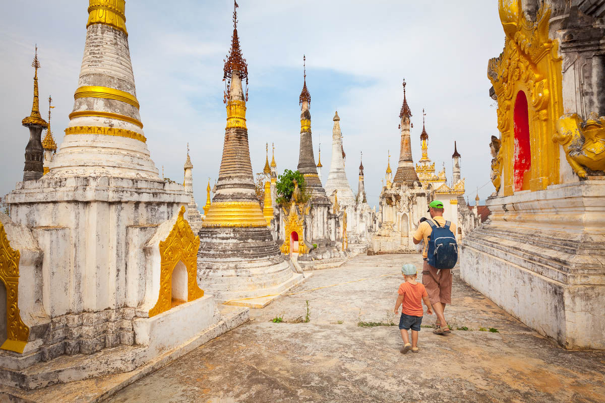 Father and Son walking through Buddhist Temple
