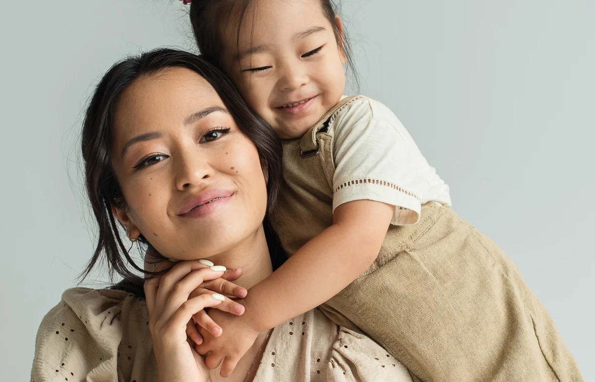 Mom and daughter together smiling