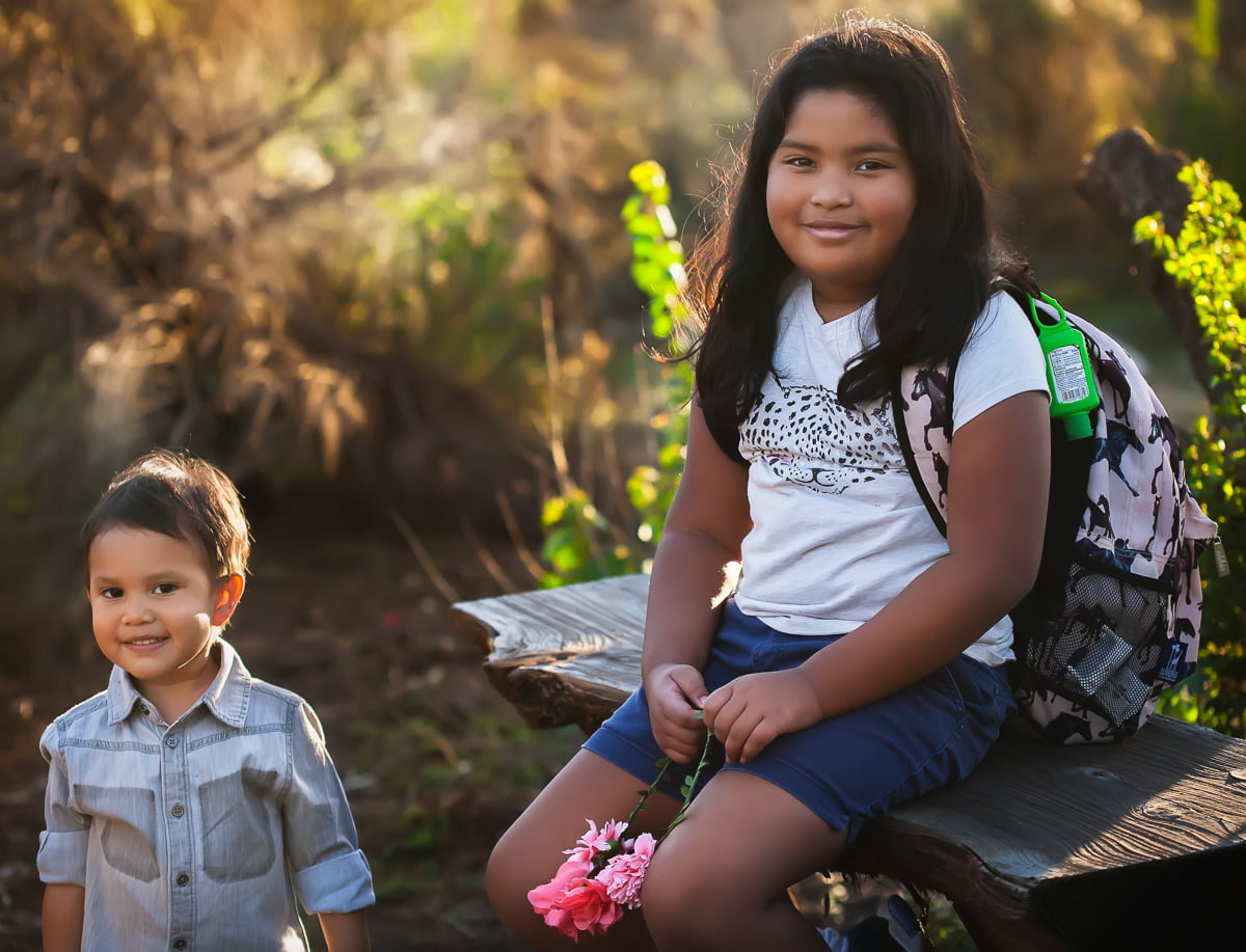 Brother and sister on a hike.
