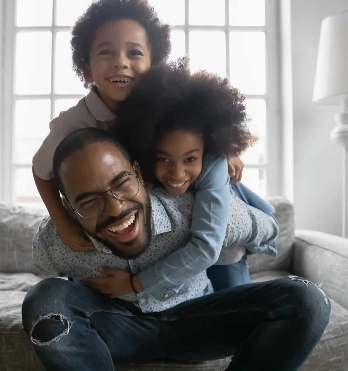 Dad playing with son and daughter