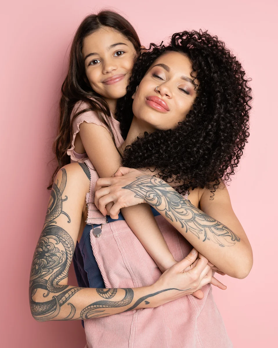 Tattoo'd mom and daughter together