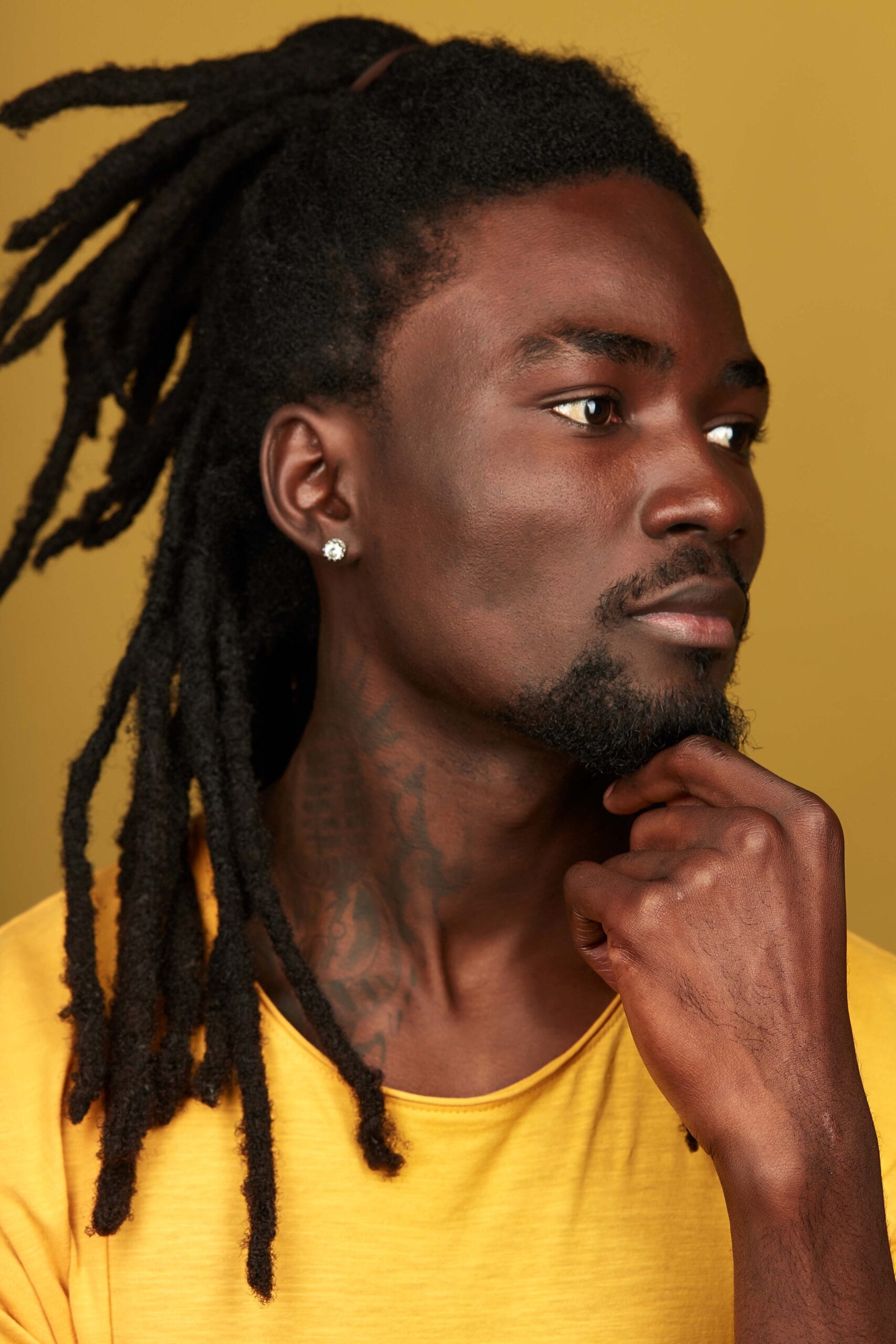 Young male with dredlocks and earring